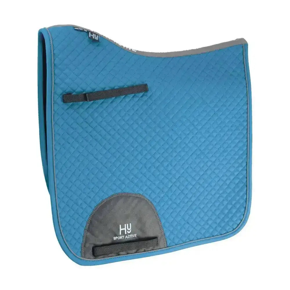 Blue quilted hy sport active dressage saddle pad with gray accents black straps and signature hywither cut design