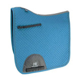 Blue quilted hy sport active dressage saddle pad with gray accents black straps and signature hywither cut design