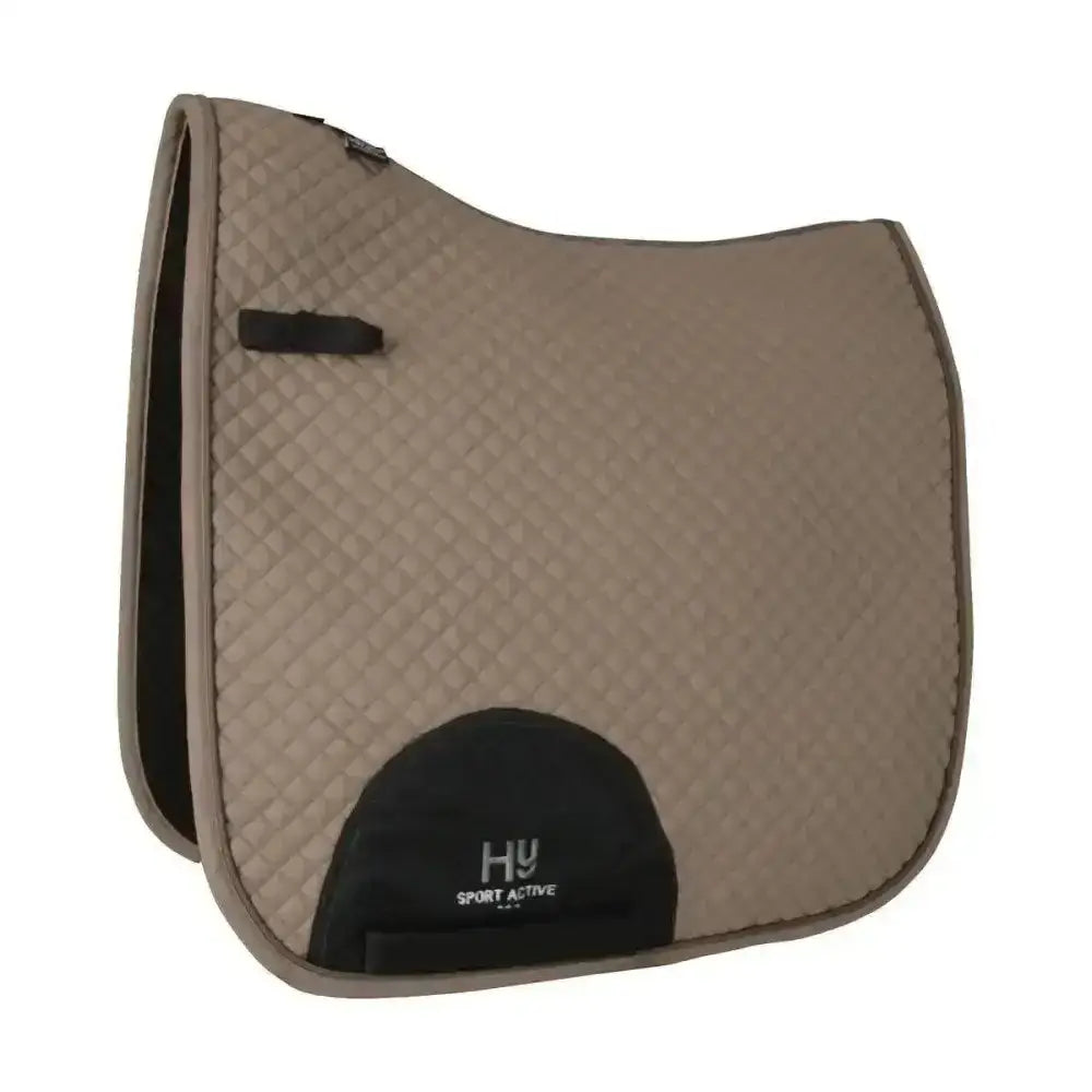 Beige quilted hy sport active dressage saddle pad with black trim and signature hywither cut logo patch