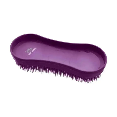 Purple plastic sport miracle grooming horse brush with dense dark bristles and smooth contoured handle