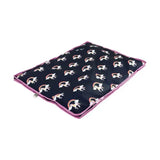 Black fabric unicorn dog bed storage bag with pink trim and fun unicorn themed rainbow pattern