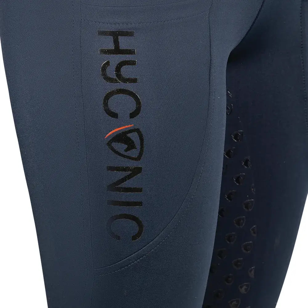 Dark navy hyconic torrellas riding tights with black embroidered branding and perforated side panels for riding