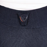Dark blue textured fabric collar with black brand tag and orange line on hyconic valloria denim riding tights