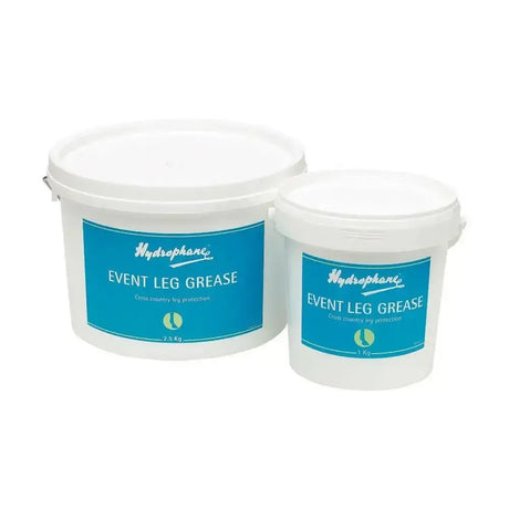 Two white plastic buckets of hydrophane event leg grease with blue labels for cross country fences leg protection