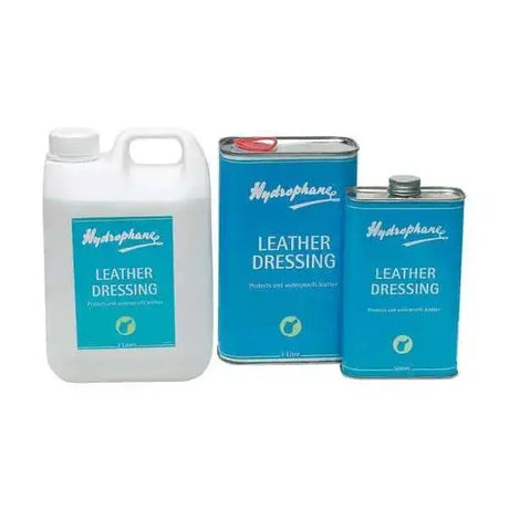 Blue hydrophane leather dressing cans with white labels and silver lids for waterproofing leather and horse tack care