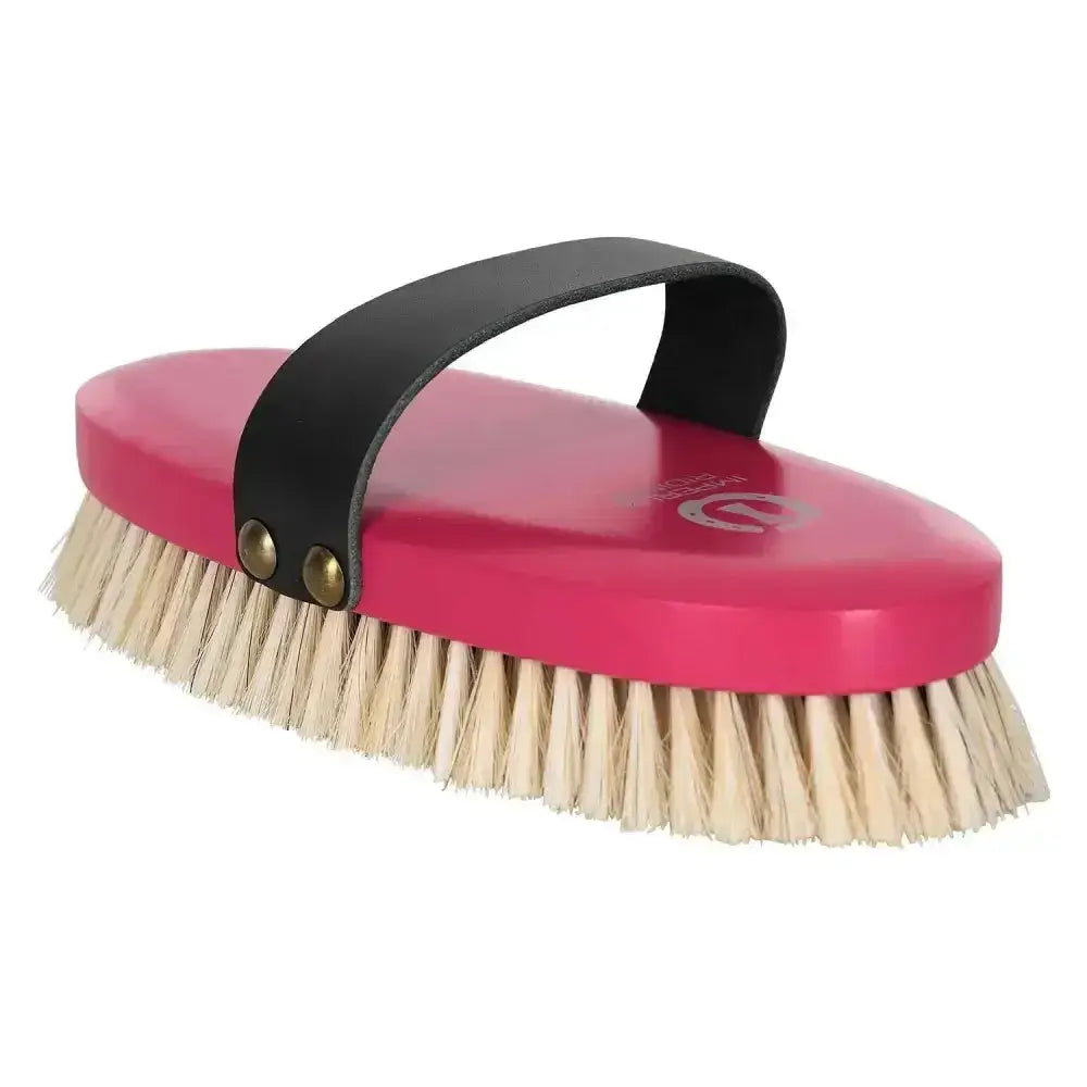 Bright pink imperial riding soft brush with natural bristles and a black leather handle for grooming horses