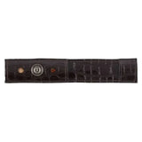 Dark brown crocodile-embossed pardouz leather riding spur protectors with silver logo and two decorative stones