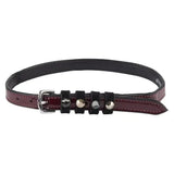 A sleek imperial riding spur leather belt in black and burgundy with silver hardware and pardouz patent leather accents