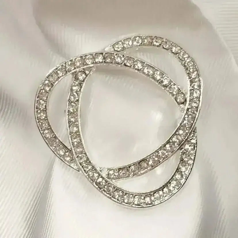 Silver rhinestone infinity stock pin with three interlocking circular bands and stunning diamante detail