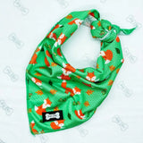 Green fox-patterned dog bandana with lighter green stitching and orange white accents from inquisitive fox cooling bandana