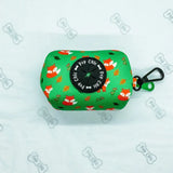 Green fabric inquisitive fox poo bag holder with playful fox pattern black pup chic top and green carabiner clip