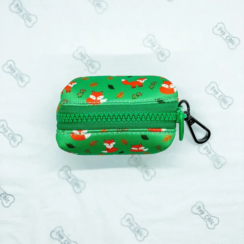 Green inquisitive fox poo bag holder pouch with zipper and black carabiner clip for easy carrying fox poo bag use