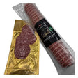 A packaged italian milano salami roll with black label and gold foil packaging perfect for snacking