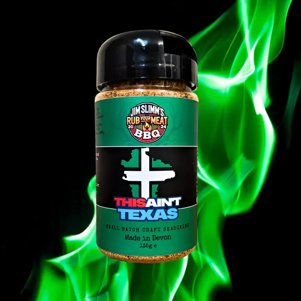 Jar of jim slim barbecue this ain t texas dry rub seasoning with green and black label and black lid from slim barbecue seasonings