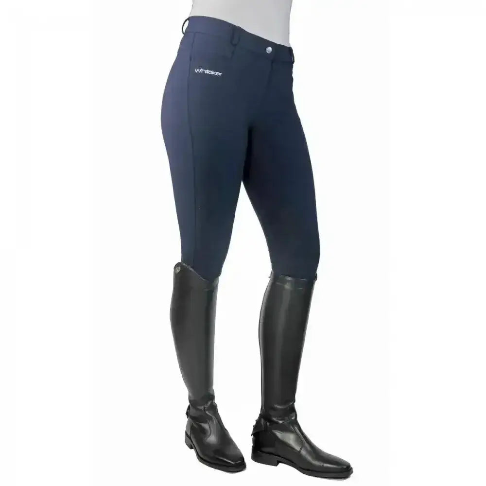 Navy blue john whitaker horbury classic ladies breeches with subtle white logo and black leather riding boots