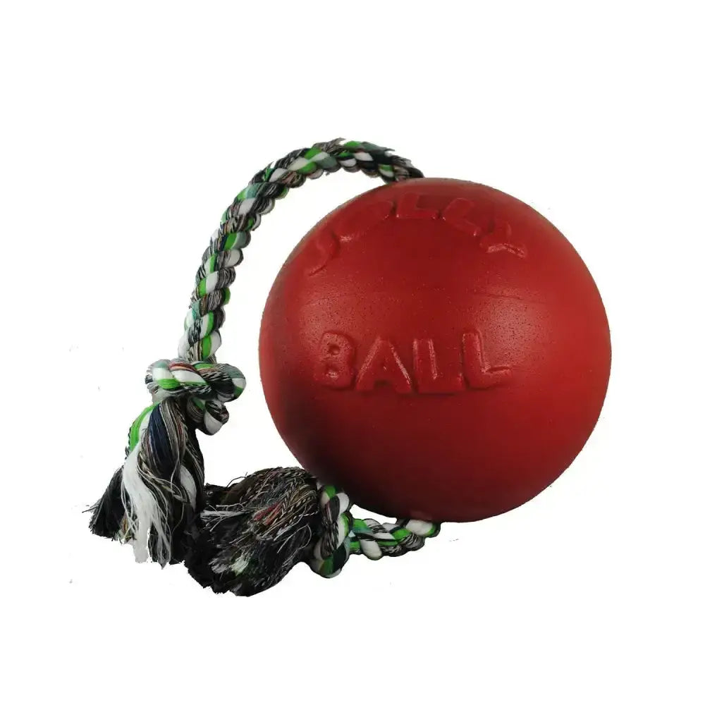 Red rubber dog toy ball with braided green white and black rope handle from jolly pets romp-n-roll red
