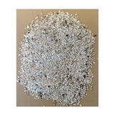 A pile of light gray jondo flint grit with white and dark minerals hard insoluble grit from heygates flint grit