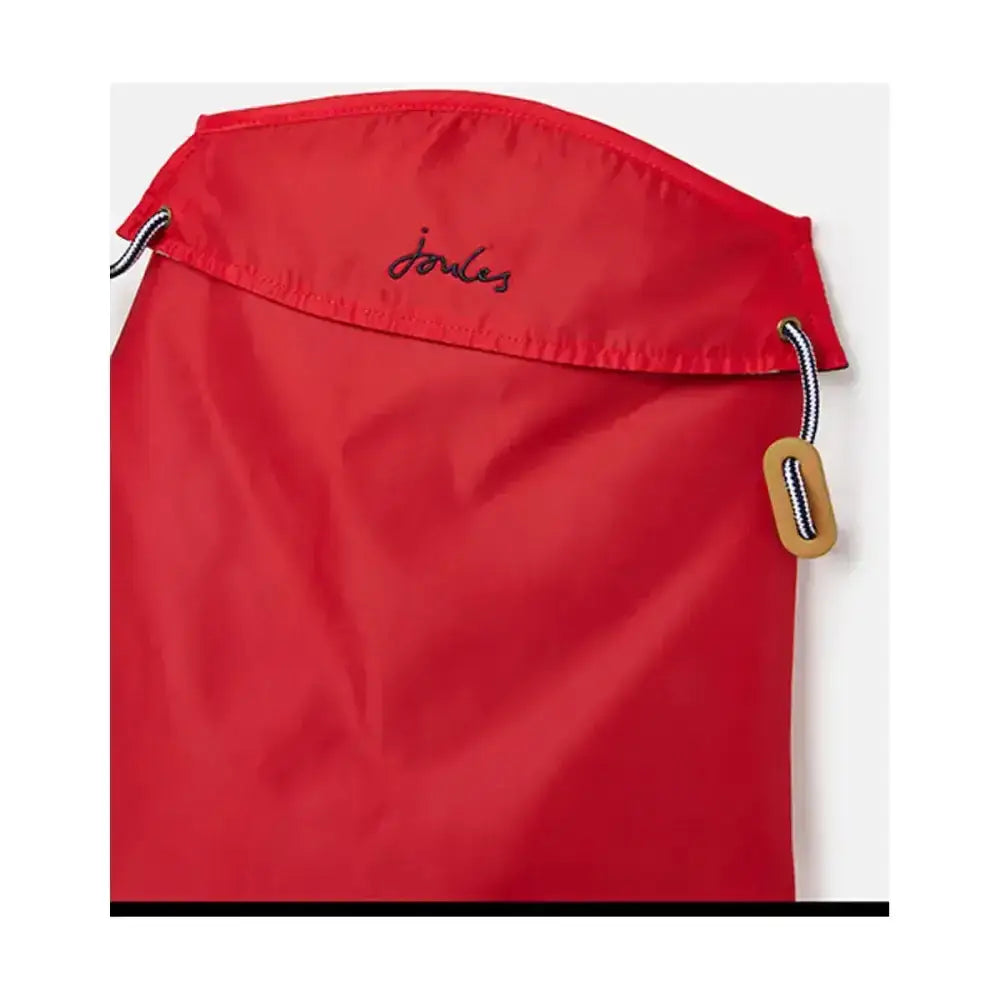 Red drawstring bag with black embroidered joules logo and wooden toggle perfect for storing joules raincoat or dog apparel