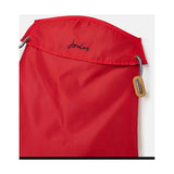 Red drawstring bag with black embroidered joules logo and wooden toggle perfect for storing joules raincoat or dog apparel