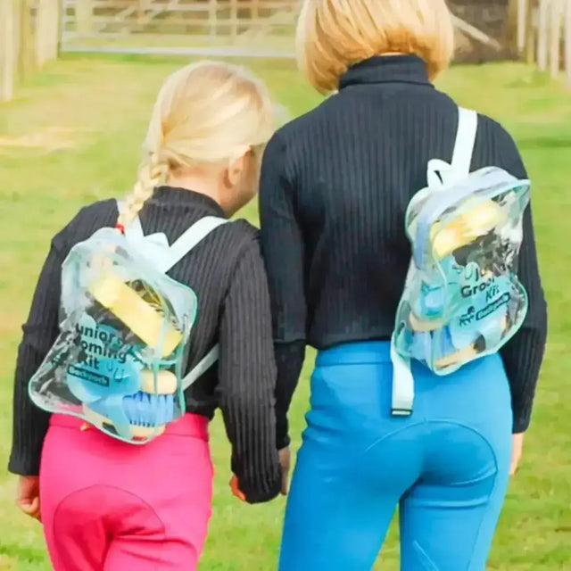 Transparent plastic junior grooming kit backpack with white straps and printed text junior grooming kit