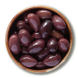 A rustic brown ceramic dish filled with glossy dark purple kalamata whole olives perfect alongside delphi stuffed green olives