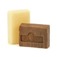 Brown rectangular bar of kevin bacons active soap with embossed branding in front of a pale yellow soap bar