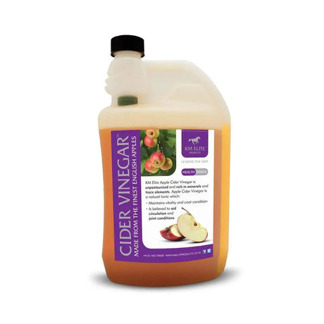 Km elite cider vinegar in a translucent jug with a purple label featuring apples supports digestive function naturally