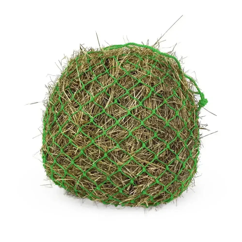 A round green elite deluxe haynet made from extra strong polyethylene encases a dense bundle of dried hay