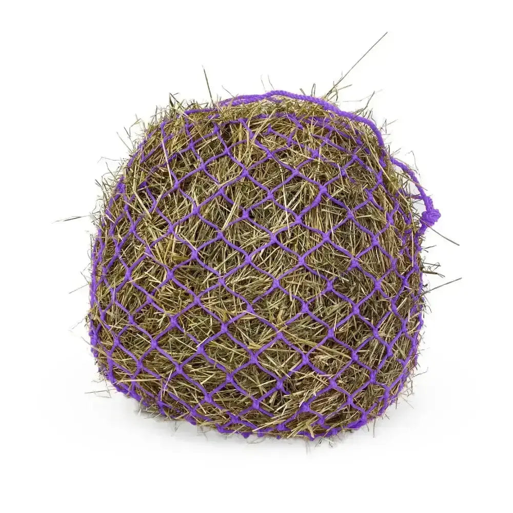 A round purple mesh km elite deluxe haynet made from extra strong polyethylene filled with golden brown hay