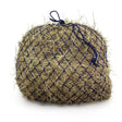 A round beige hay bale in a dark blue mesh net with tied handles from the elite deluxe haynet extra strong jumbo range