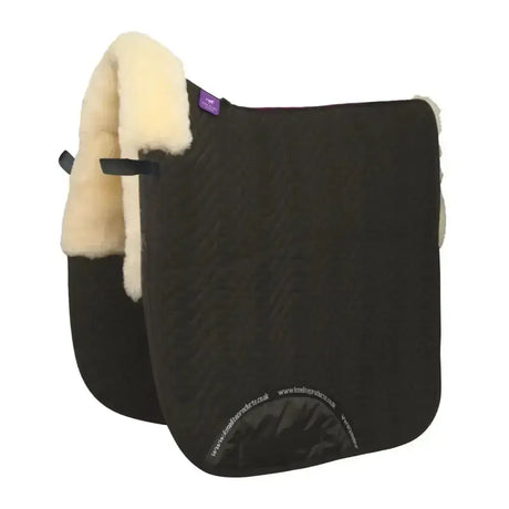 Black half lined dressage square with cream sheepskin lining and purple km elite brand tag for dressage use