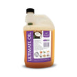 A translucent orange bottle of km elite ultimate oil with black cap and purple label featuring coconuts and bioactive nutrients including wheatgerm oil