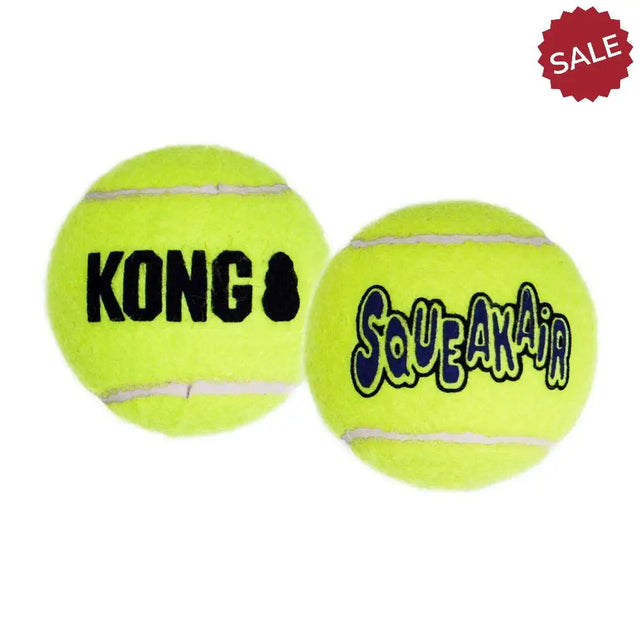 Bright yellow kong air squeaker and squeakair squeaker tennis balls with white seams perfect for dog toys fabric play