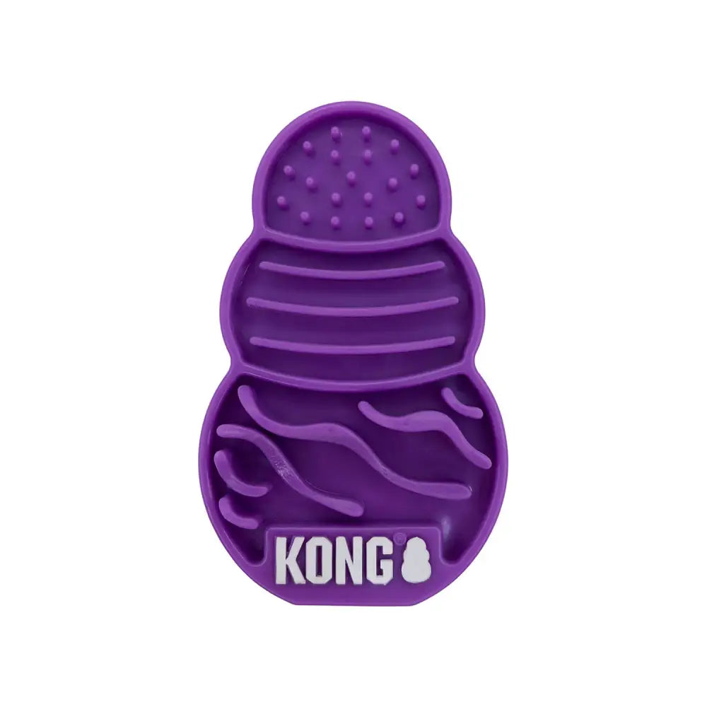 Purple silicone kong cat licks treat pad with textured compartments for oral health and slow treat dispensing