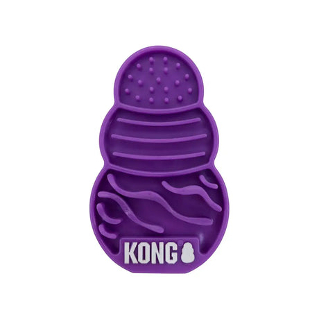 Purple silicone kong cat licks treat pad with textured compartments for oral health and slow treat dispensing