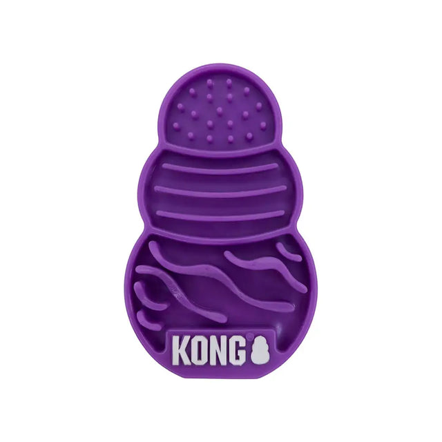 Purple silicone kong cat licks treat pad with textured compartments for oral health and slow treat dispensing