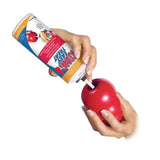 Red glossy plastic kong classic easy treat toy being filled from its branded canister gold standard dog toys