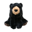 A plush kong comfort kiddos bear in black with a tan snout and brown paw pads sitting upright