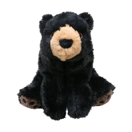 A plush kong comfort kiddos bear in black with a tan snout and brown paw pads sitting upright