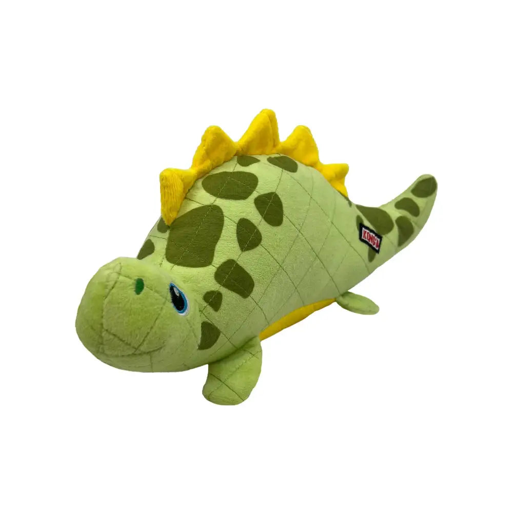 A soft green and yellow plush stegosaurus toy with blue eyes and quilted texture from kong dynos roars collection