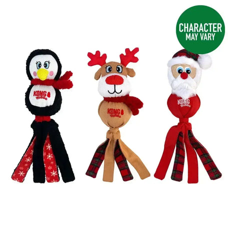 Three kong holiday wubba plush dog toys featuring a penguin red scarf reindeer plaid santa claus legs holiday wubba arctic