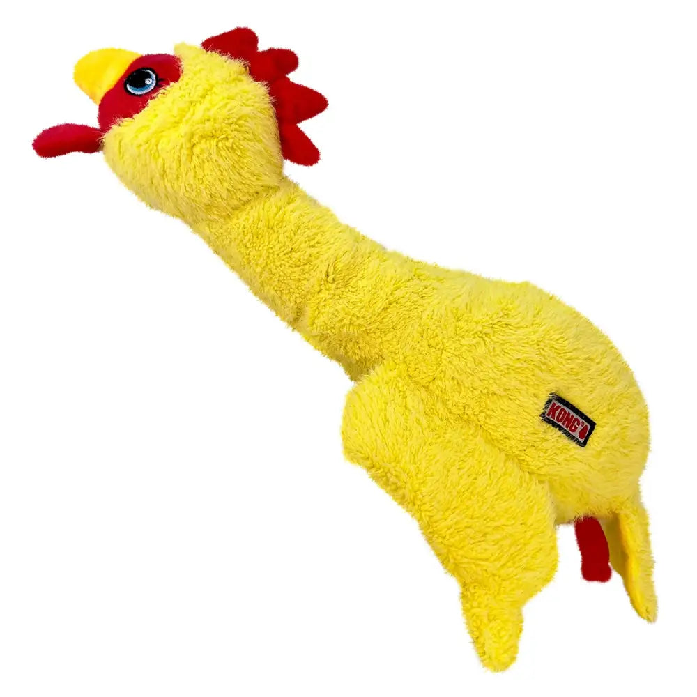 Yellow soft plush dog toy kong scruffs chicken with red comb blue eye and black kong brand tag on its side