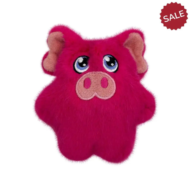 A plush pink kong snuzzles mini pig toy with embroidered blue eyes and stitched snout perfect for pets