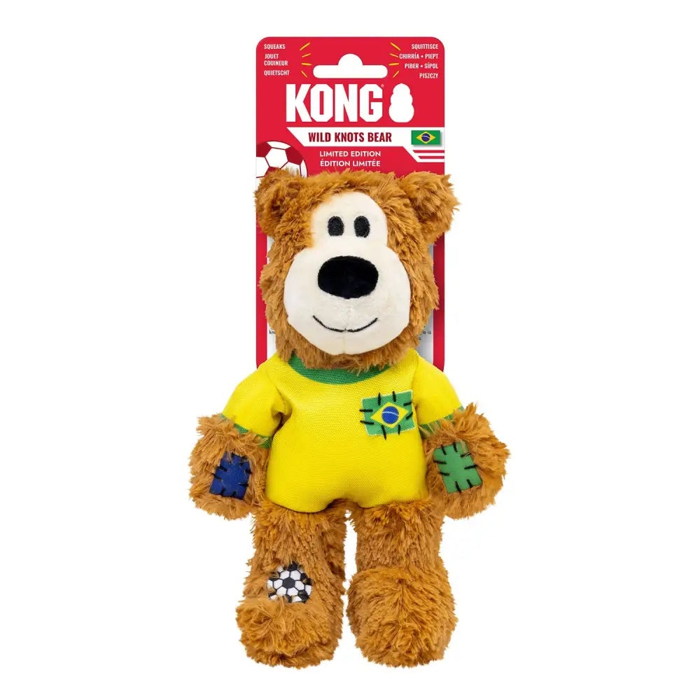 A plush brown kong wild knots teddy bear in yellow brazil soccer jersey with internal knotted rope and patchwork details