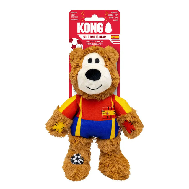 A plush brown kong wild knots sport esp bear with internal knotted rope wearing a spain soccer jersey and shorts