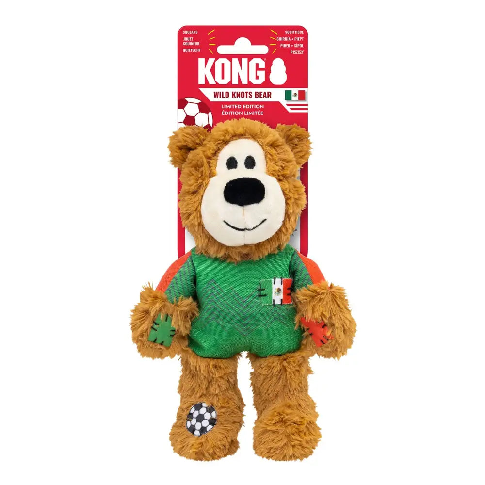 A plush brown kong wild knots bear wearing a green and orange knots sport mex jersey with mexican flag patches