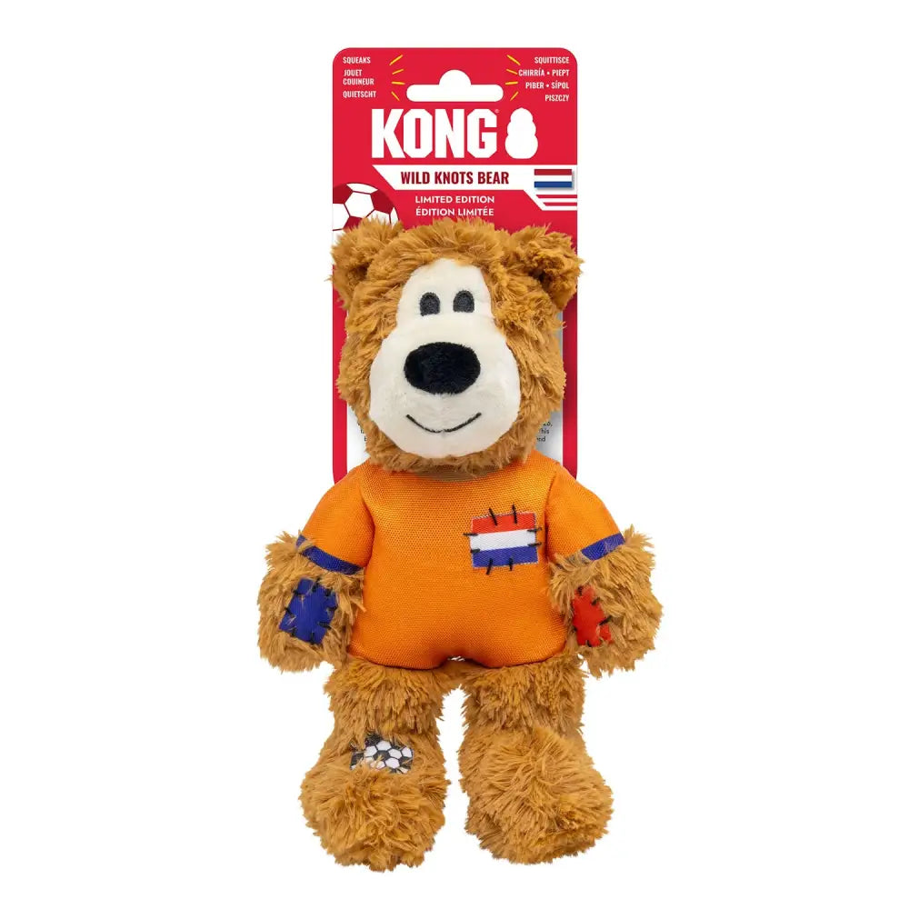A plush brown kong wild knots nld bear netherlands with internal knotted rope wearing orange soccer jersey with dutch flag patch