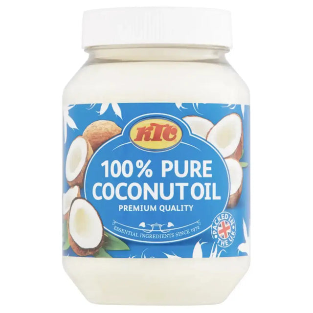 A clear glass jar with white lid contains ktc pure coconut oil labeled in blue and yellow with coconut images