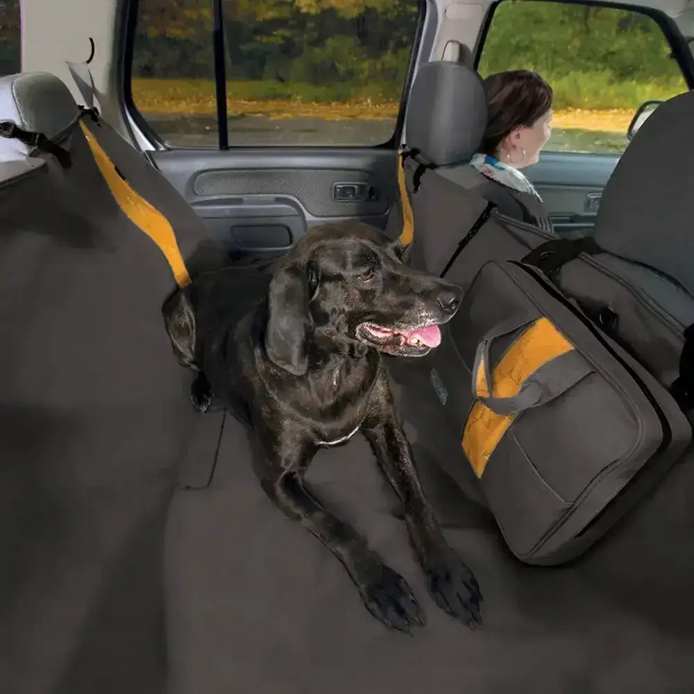 Gray and yellow kurgo wander hammock car seat cover with adjustable straps hangs securely and blocks access for pets