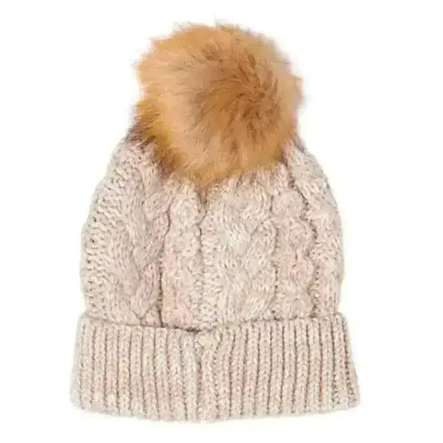 Beige ladies cable knitted pom pom hat with warm cable knitted texture and fluffy tan pom pom on top